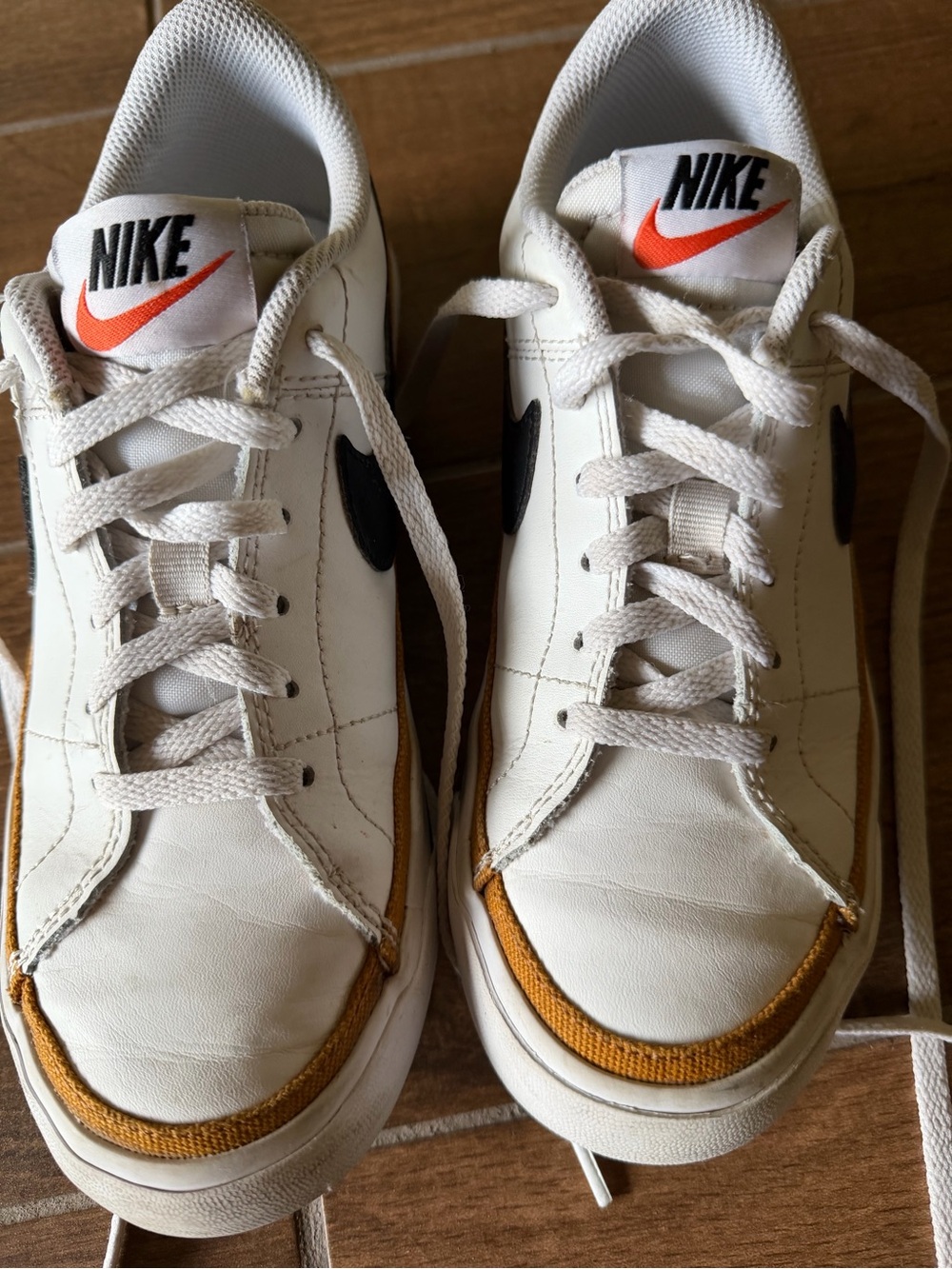 Nike White Sneakers with Black Swoosh and Gold Trim - Kids